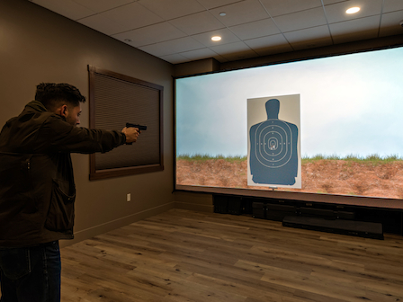 Man practicing in Firearms Training Simulator at Preserve Resort & Spa in 2024